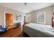 Bedroom featuring hardwood floors, neutral color walls, and natural light at 2368 Saint Davids Nw Sq # 4, Kennesaw, GA 30152
