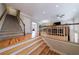 Open-concept foyer with wood floors, stairs, and views of the spacious living area at 2368 Saint Davids Nw Sq # 4, Kennesaw, GA 30152