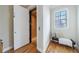 Home elevator with adjacent bench and wood floors near a window with natural light at 2368 Saint Davids Nw Sq # 4, Kennesaw, GA 30152