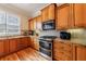 Well-appointed kitchen featuring wooden cabinets, granite countertops and stainless steel appliances at 2368 Saint Davids Nw Sq # 4, Kennesaw, GA 30152