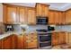 Kitchen with stainless steel appliances, granite countertops, and wood cabinetry at 2368 Saint Davids Nw Sq # 4, Kennesaw, GA 30152