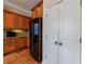 Kitchen with wooden cabinetry, a stainless steel refrigerator and a pantry at 2368 Saint Davids Nw Sq # 4, Kennesaw, GA 30152