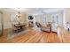 Spacious living area featuring hardwood floors, dining area, fireplace, and natural light at 2368 Saint Davids Nw Sq # 4, Kennesaw, GA 30152
