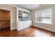 Living Room featuring hardwood floors, built-in shelving, and natural light from a window at 2368 Saint Davids Nw Sq # 4, Kennesaw, GA 30152