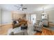 Open living space with hardwood floors, living and dining area, and staircase at 2368 Saint Davids Nw Sq # 4, Kennesaw, GA 30152