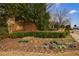 Community sign with flowers and manicured hedges at 2368 Saint Davids Nw Sq # 4, Kennesaw, GA 30152