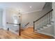 Elegant staircase with hardwood steps, white railing, and natural light at 2368 Saint Davids Nw Sq # 4, Kennesaw, GA 30152