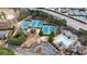 Aerial view showcasing meticulously maintained tennis courts and a refreshing pool in a landscaped setting at 2368 Saint Davids Nw Sq # 4, Kennesaw, GA 30152