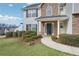 Home featuring a stone facade, a well-maintained lawn, and a inviting walkway to the front door at 3426 Bridle Brook Drive Ne Dr, Auburn, GA 30011