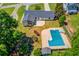 Aerial view of the property, including the pool, backyard, and surrounding neighborhood at 3625 Knoll Crest Trl, Buford, GA 30519