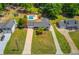 Wide aerial view of the house showing its location between neighboring houses at 3625 Knoll Crest Trl, Buford, GA 30519