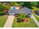 Aerial view showcasing the home, long driveway, and inviting swimming pool area at 3625 Knoll Crest Trl, Buford, GA 30519