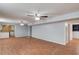 Open basement area featuring wooden floors, a kitchen, and plenty of open space at 3625 Knoll Crest Trl, Buford, GA 30519