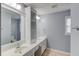 Well-lit bathroom featuring a double vanity with storage, framed mirror and neutral color palette at 3625 Knoll Crest Trl, Buford, GA 30519