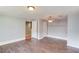 Bedroom featuring laminate floors, light blue walls, and ceiling fan at 3625 Knoll Crest Trl, Buford, GA 30519