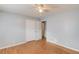 Spacious bedroom with hardwood floors, ceiling fan and a walk-in closet for extra storage space at 3625 Knoll Crest Trl, Buford, GA 30519