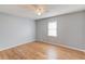 This bedroom features hardwood floors, blue walls, and a ceiling fan at 3625 Knoll Crest Trl, Buford, GA 30519