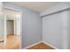 Cozy bedroom with hardwood-style flooring, light gray walls, and bright natural light at 3625 Knoll Crest Trl, Buford, GA 30519
