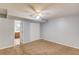 Spacious bedroom with neutral carpet, closet, and ceiling fan, creating a cozy and inviting atmosphere at 3625 Knoll Crest Trl, Buford, GA 30519