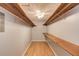Walk-in closet providing ample storage with wooden shelves and bright overhead lighting at 3625 Knoll Crest Trl, Buford, GA 30519