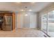 Bright dining area features tile flooring and sliding glass doors to backyard at 3625 Knoll Crest Trl, Buford, GA 30519