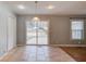 Bright dining area with a sliding glass door for backyard access at 3625 Knoll Crest Trl, Buford, GA 30519