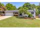 Charming single-story home featuring a lush green lawn and well-maintained landscaping at 3625 Knoll Crest Trl, Buford, GA 30519