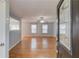 Bright living room with hardwood floors, a ceiling fan, and natural light at 3625 Knoll Crest Trl, Buford, GA 30519