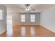 Spacious living room featuring hardwood floors and sliding door to backyard at 3625 Knoll Crest Trl, Buford, GA 30519