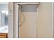 Walk-in shower with glass door and shower head provides a functional and accessible space at 3625 Knoll Crest Trl, Buford, GA 30519