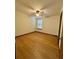 Bright, empty bedroom featuring neutral walls, wood-look floors, ceiling fan, and natural light at 9033 Greystone Rd, Jonesboro, GA 30238