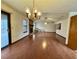 Bright living room with wood floors, fireplace, and sliding glass doors leading to deck at 9033 Greystone Rd, Jonesboro, GA 30238
