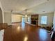 Spacious living room features wood floors, stone fireplace, and sliding glass doors at 9033 Greystone Rd, Jonesboro, GA 30238