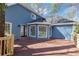 Exterior of the blue home featuring a wood deck and bay window with a private backyard at 3017 Lana Ln, Marietta, GA 30066
