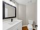 Modern half bathroom featuring a stylish sink, faucet, and toilet at 3017 Lana Ln, Marietta, GA 30066