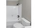 Bright bathroom with a tiled shower and tub combo, new toilet, and modern fixtures at 3017 Lana Ln, Marietta, GA 30066