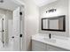 Bathroom showcasing a sleek black framed mirror above a white vanity with modern fixtures at 3017 Lana Ln, Marietta, GA 30066