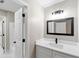 Neutral bathroom with new vanity, solid surface countertop, new lighting, and dark fixtures at 3017 Lana Ln, Marietta, GA 30066