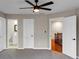 Neutral toned bedroom with a ceiling fan and a view to other areas of the home at 3017 Lana Ln, Marietta, GA 30066