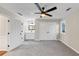 Spacious bedroom featuring neutral walls, a ceiling fan, ensuite bathroom, and generous closet space at 3017 Lana Ln, Marietta, GA 30066