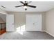 Bedroom features gray carpet, light gray paint, a ceiling fan, and closets at 3017 Lana Ln, Marietta, GA 30066