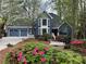 Charming two-story home with meticulous landscaping and a welcoming three-car garage at 3017 Lana Ln, Marietta, GA 30066