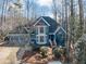 Aerial view of a blue two-story home featuring mature landscaping, and a well-manicured lawn at 3017 Lana Ln, Marietta, GA 30066