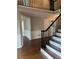 Beautiful foyer featuring hardwood floors, a staircase, and wainscoting, leading to other rooms at 3017 Lana Ln, Marietta, GA 30066