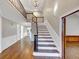 Elegant foyer with hardwood floors, staircase, and chandelier, creating a grand entrance at 3017 Lana Ln, Marietta, GA 30066