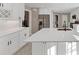 Spacious, sunlit kitchen with a central island, modern appliances, quartz countertops, and white cabinetry at 3017 Lana Ln, Marietta, GA 30066