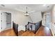 Upstairs landing featuring hardwood floors, access to several bedrooms, a chandelier and decorative wainscotting at 3017 Lana Ln, Marietta, GA 30066
