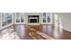 Spacious living room with hardwood floors, fireplace, and large windows at 3017 Lana Ln, Marietta, GA 30066