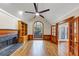 Cozy living room boasts a fireplace, hardwood floors, built-in shelving, and arched window at 3017 Lana Ln, Marietta, GA 30066