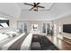 Comfortable main bedroom features a tray ceiling and many windows to let in natural light at 3017 Lana Ln, Marietta, GA 30066